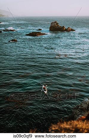Friends kayaking in sea, Big Sur, California, United States View Large Photo Image Stock Photo - Friends kayaking in sea, Big Sur, California, United States. Fotosearch