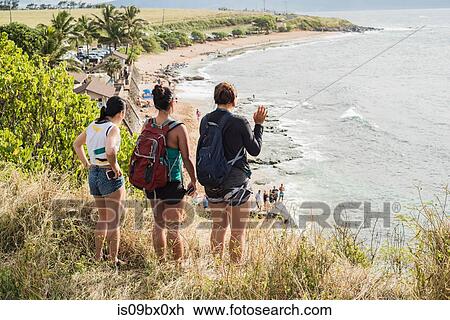 Friends looking down to Hookipa Beach, Maui, Hawaii View Large Photo Image Stock Image - Friends looking down to Hookipa Beach, Maui, Hawaii. Fotosearch