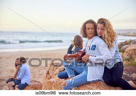 Friends relaxing on beach, Plettenberg Bay, Western Cape, South Africa View Large Photo Image Stock Photograph - Friends relaxing on beach, Plettenberg Bay, Western Cape, South Africa. Fotosearch