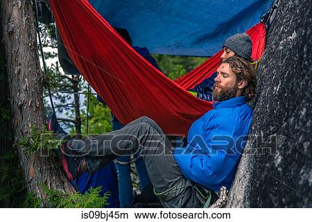 Picture - Friends with hammock, relaxing, Squamish, Canada. Fotosearch