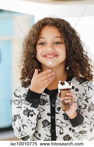 Girl eating ice cream at home View Large Photo Image Stock Photography - Girl eating ice cream at home. Fotosearch