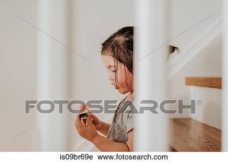 Girl enjoying watermelon on stairs View Large Photo Image Stock Image - Girl enjoying watermelon on stairs. Fotosearch