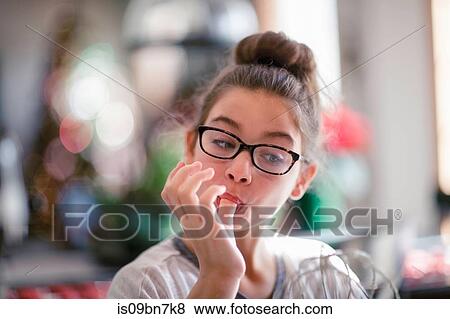 Girl licking christmas cookie dough from fingers in kitchen View Large Photo Image Stock Photo - Girl licking christmas cookie dough from fingers in kitchen. Fotosearch