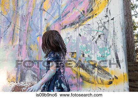 Girl painting wall View Large Photo Image Stock Photograph - Girl painting wall. Fotosearch