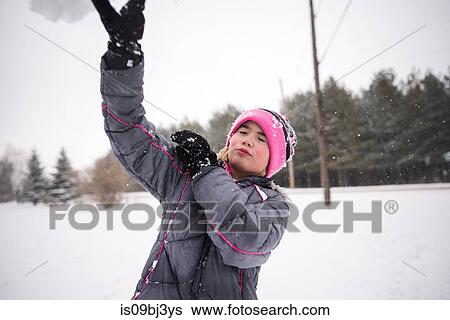 Girl playing in snow View Large Photo Image Stock Photograph - Girl playing in snow. Fotosearch