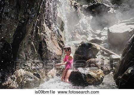Girl playing in waterfall, Tofino, Canada View Large Photo Image Stock Image - Girl playing in waterfall, Tofino, Canada. Fotosearch