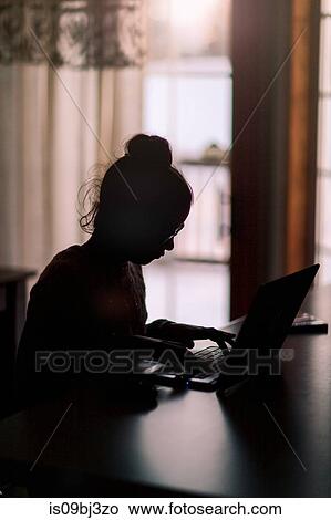 Girl using laptop at home View Large Photo Image Picture - Girl using laptop at home. Fotosearch