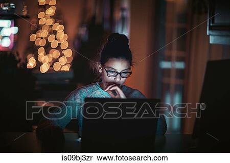 Girl using laptop at home View Large Photo Image Stock Photography - Girl using laptop at home. Fotosearch