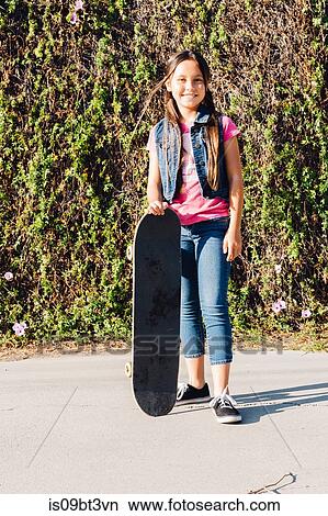 Girl with her skateboard View Large Photo Image Picture - Girl with her skateboard. Fotosearch