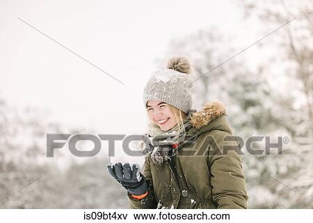 Girl with snow ball in winter landscape View Large Photo Image Stock Photo - Girl with snow ball in winter landscape. Fotosearch
