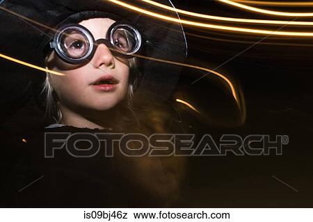 Girl with sparkler wearing flying goggles, long exposure View Large Photo Image Stock Photo - Girl with sparkler wearing flying goggles, long exposure. Fotosearch