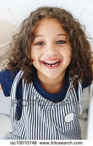 Stock Photo - Girl with toothy smile. Fotosearch
