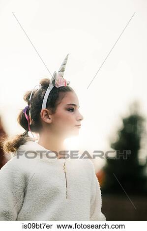 Girl with unicorn hairband in park View Large Photo Image Stock Photography - Girl with unicorn hairband in park. Fotosearch