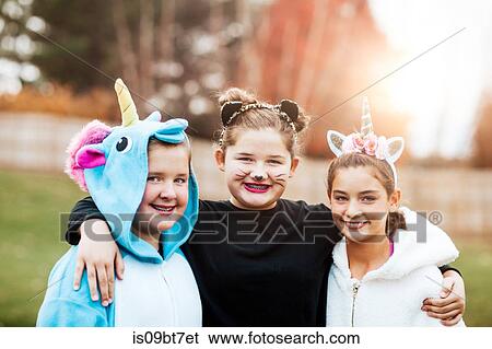 Girls in halloween costume posing in park View Large Photo Image Stock Photograph - Girls in halloween costume posing in park. Fotosearch