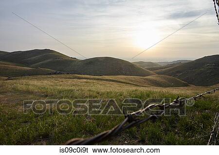 Grassy landscape, mountains in background, Tehachapi, California, United States View Large Photo Image Stock Photograph - Grassy landscape, mountains in background, Tehachapi, California, United States. Fotosearch