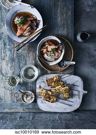Stock Photo - Grilled tofu, caramelised yuzu miso and nishin soba. Fotosearch