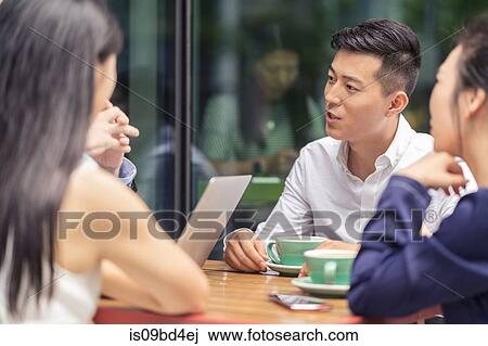 Group of businesspeople, having meeting at cafe, outdoors View Large Photo Image Stock Image - Group of businesspeople, having meeting at cafe, outdoors. Fotosearch