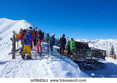 Group of skiers preparing on snow covered mountain, Aspen, Colorado, USA View Large Photo Image Stock Photo - Group of skiers preparing on snow covered mountain, Aspen, Colorado, USA. Fotosearch