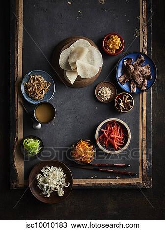 Stock Image - Gujeoulpan (korean tiny crepe 8 fillings). Fotosearch