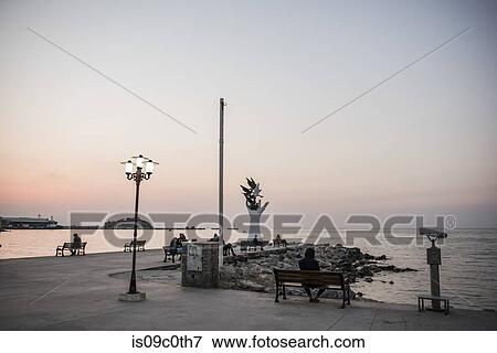 Hand of Peace sculpture and people on pierside benches, Kusadasi, Izmir, Turkey View Large Photo Image Stock Photo - Hand of Peace sculpture and people on pierside benches, Kusadasi, Izmir, Turkey. Fotosearch