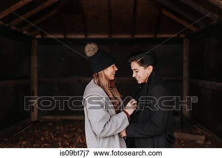 Stock Photo - Happy couple enjoying romance and hugs. Fotosearch