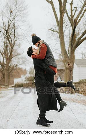 Happy couple enjoying snowy landscape, Georgetown, Canada View Large Photo Image Stock Photo - Happy couple enjoying snowy landscape, Georgetown, Canada. Fotosearch