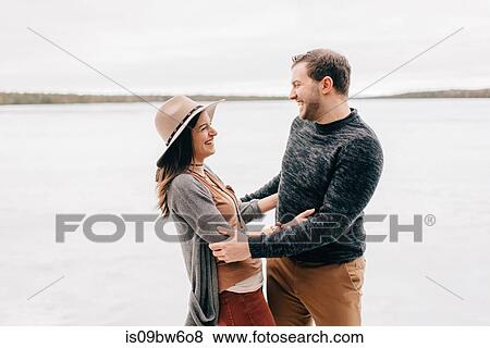 Happy couple in snowy landscape View Large Photo Image Stock Photo - Happy couple in snowy landscape. Fotosearch