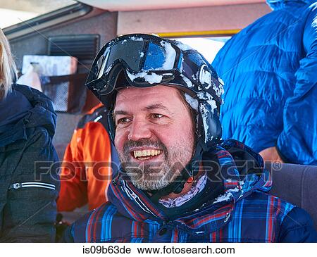 Happy mature male skier in snow coach, Aspen, Colorado, USA View Large Photo Image Stock Image - Happy mature male skier in snow coach, Aspen, Colorado, USA. Fotosearch
