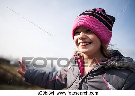 Happy young girl with beanie hat View Large Photo Image Stock Image - Happy young girl with beanie hat. Fotosearch