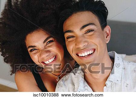 Happy young woman and boyfriend, head and shoulder portrait View Large Photo Image Stock Photo - Happy young woman and boyfriend, head and shoulder portrait. Fotosearch