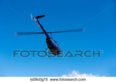 Helicopter flying against blue sky, low angle view, Cape Town, Western Cape, South Africa View Large Photo Image Stock Photography - Helicopter flying against blue sky, low angle view, Cape Town, Western Cape, South Africa. Fotosearch