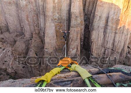 Highlining in Piedra Parada, south Patagonia, Argentina View Large Photo Image Stock Photo - Highlining in Piedra Parada, south Patagonia, Argentina. Fotosearch