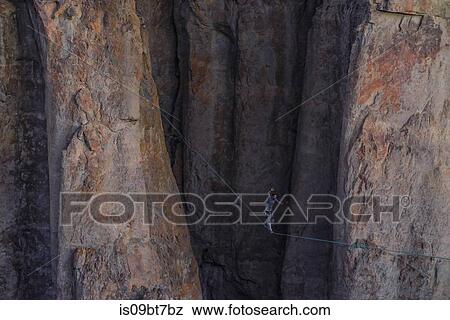 Highlining in Piedra Parada, south Patagonia, Argentina View Large Photo Image Stock Photo - Highlining in Piedra Parada, south Patagonia, Argentina. Fotosearch