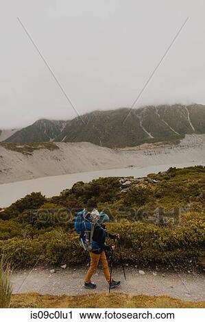 Hiker and baby exploring trail, Wanaka, Taranaki, New Zealand View Large Photo Image Stock Image - Hiker and baby exploring trail, Wanaka, Taranaki, New Zealand. Fotosearch