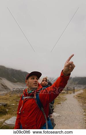 Hiker and baby exploring trail, Wanaka, Taranaki, New Zealand View Large Photo Image Stock Photograph - Hiker and baby exploring trail, Wanaka, Taranaki, New Zealand. Fotosearch