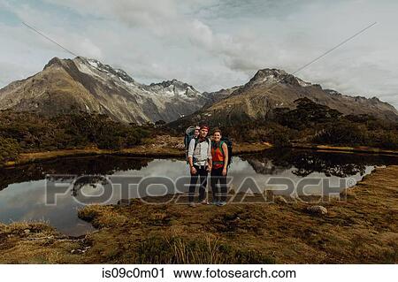 Hiker couple with baby by lake, Queenstown, Canterbury, New Zealand View Large Photo Image Stock Image - Hiker couple with baby by lake, Queenstown, Canterbury, New Zealand. Fotosearch