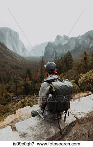 Stock Photo - Hiker exploring nature reserve, Yosemite National Park, California, United States. Fotosearch