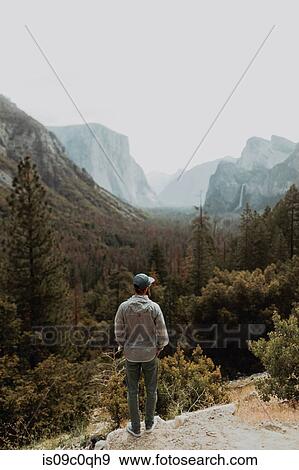 Hiker exploring nature reserve, Yosemite National Park, California, United States View Large Photo Image Stock Photo - Hiker exploring nature reserve, Yosemite National Park, California, United States. Fotosearch
