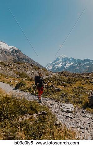 Stock Photography - Hiker exploring trail, Wanaka, Taranaki, New Zealand. Fotosearch