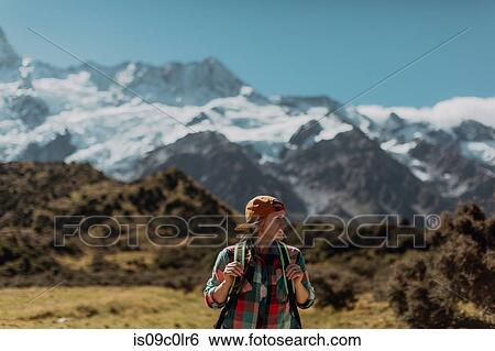 Hiker exploring wilderness, Wanaka, Taranaki, New Zealand View Large Photo Image Stock Photograph - Hiker exploring wilderness, Wanaka, Taranaki, New Zealand. Fotosearch
