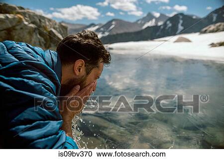 Hiker freshening up at lake, Mineral King, California, United States View Large Photo Image Stock Image - Hiker freshening up at lake, Mineral King, California, United States. Fotosearch