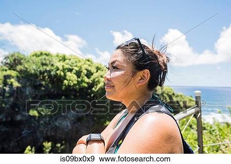 Stock Photo - Hiker on coast of Waipipi Trail, Maui, Hawaii. Fotosearch