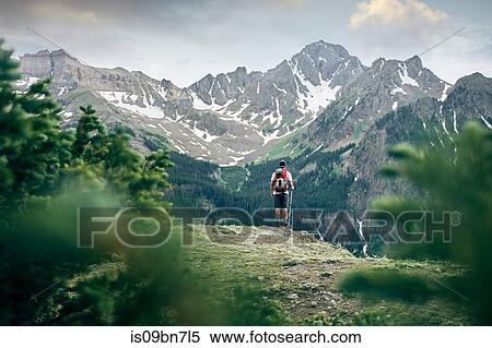 Hiker on mountain peak, Mount Sneffels, Ouray, Colorado, USA View Large Photo Image Stock Photography - Hiker on mountain peak, Mount Sneffels, Ouray, Colorado, USA. Fotosearch