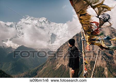 Hiker on peak, Annapurna Circuit, view to Annapurna 2 mountain, the Himalayas, Manang, Nepal View Large Photo Image Stock Photograph - Hiker on peak, Annapurna Circuit, view to Annapurna 2 mountain, the Himalayas, Manang, Nepal. Fotosearch
