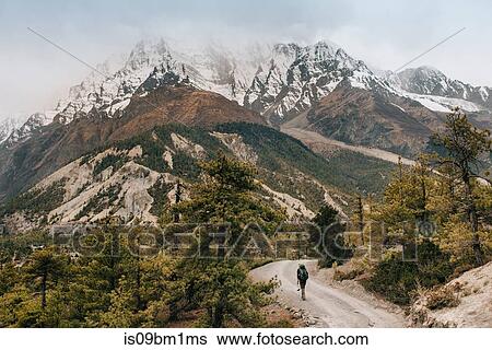 Hiker on trail, Annapurna Circuit, the Himalayas, Manang, Nepal View Large Photo Image Stock Photograph - Hiker on trail, Annapurna Circuit, the Himalayas, Manang, Nepal. Fotosearch