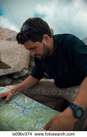 Hiker reading map, Mineral King, California, United States View Large Photo Image Picture - Hiker reading map, Mineral King, California, United States. Fotosearch