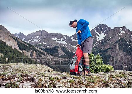 Hiker taking break, Mount Sneffels, Ouray, Colorado, USA View Large Photo Image Stock Photo - Hiker taking break, Mount Sneffels, Ouray, Colorado, USA. Fotosearch