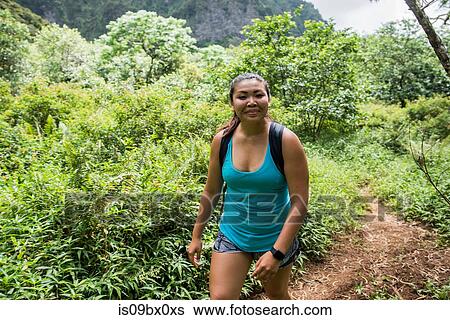 Hiker walking in rainforest, Iao Valley, Maui, Hawaii View Large Photo Image Stock Photograph - Hiker walking in rainforest, Iao Valley, Maui, Hawaii. Fotosearch
