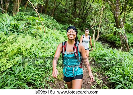 Stock Photograph - Hikers on Moanalua Valley Trail, Oahu, Hawaii. Fotosearch