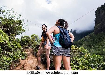 Hikers walking in rainforest, Iao Valley, Maui, Hawaii View Large Photo Image Picture - Hikers walking in rainforest, Iao Valley, Maui, Hawaii. Fotosearch